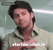 a man in a green shirt with the words starttamilchat.in written below him