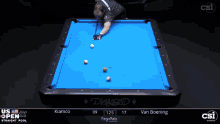 a pool table with a blue cloth that says diamond
