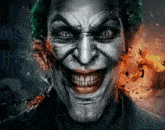 a close up of the joker 's face with a fire background