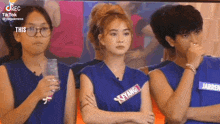 a group of people wearing blue shirts with the word fyang on the front