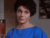 a close up of a woman 's face with her mouth open in a movie .
