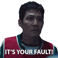 a man says it 's your fault while wearing a red and green vest