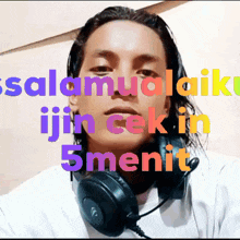 a man wearing headphones with the words " salamualaikum " above his head