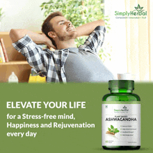 a bottle of simply herbal plant based ashwagandha with a man in the background
