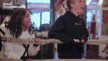 two women are in a boxing ring with the words real housewives out of context