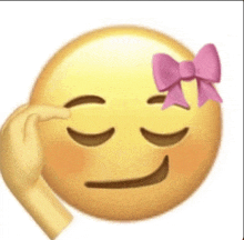 a yellow smiley face with a pink bow on it 's head .
