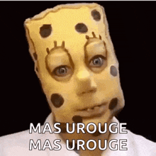 a person is wearing a spongebob mask on their head .