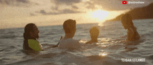 a group of people are swimming in the ocean and the caption says terbaik