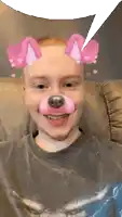 a man wearing a dog face mask with pink ears