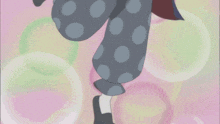 a cartoon character with polka dot pants and a pink background