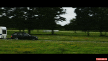 a car is towed by a trailer that says thinkiules
