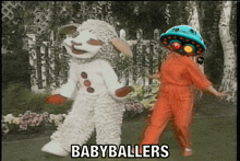 a woman in an orange jumpsuit is dancing with a sheep mascot and the words babyballers on the bottom right