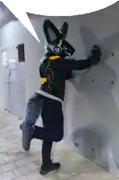 a person dressed in a furry costume with a speech bubble above them