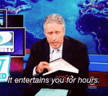 It Entertains You For Hours GIF - Jon Stewart Book Worm Book Lover GIFs