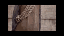 a person with a rope tied around their waist