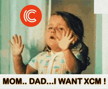 a little girl talking on a cell phone with the words mom dad i want xcm