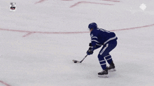 a hockey player with the number 18 on his jersey is skating on the ice