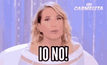 a woman is making a funny face and saying io no !