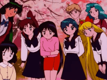 a group of anime characters are posing for a picture together