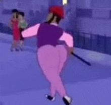a man in pink pants and a purple vest is holding a stick while ice skating .