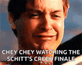 a close up of a man 's face with the words chey chey watching the schitt 's creek finale