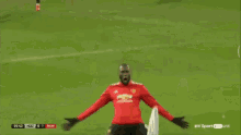 a soccer player in a red jersey with the number 39 on it