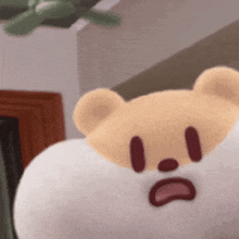 a close up of a teddy bear with a sad face on its face .