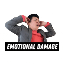 a man in a suit is covering his ears with his hands and a sticker that says emotional damage .