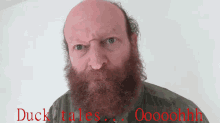 a bald man with a beard says duck tales oooohhh
