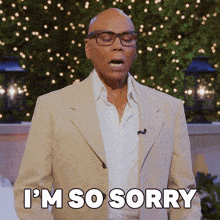 a man in a tan suit and white shirt says i 'm so sorry