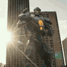 a giant robot is standing in front of a tall building .