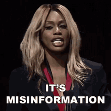 a woman says it 's misinformation in front of a podium