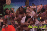 a group of people are dancing and playing guitars with a watermark that says @luna_lcdif