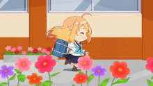 a girl in a school uniform with a blue bag on her back is walking through flowers