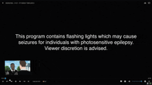 a black screen with the words " this program contains flashing lights which may cause seizures for individuals with photosensitive epilepsy