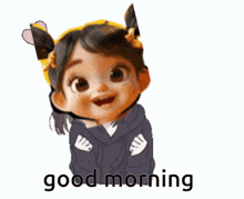 a little girl is wearing a hoodie and a headset and says good morning