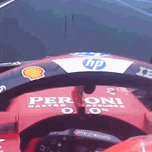 a close up of a red race car with the word peroni on it