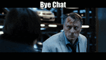 a man in a suit and tie is talking to another man and the words bye chat are above him