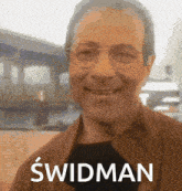 a picture of a smiling man with the name swidman on it