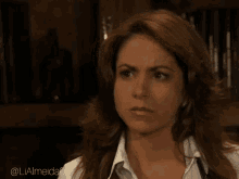 a woman with a stethoscope around her neck has the hashtag lialmeida05 on the bottom