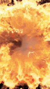 a circle of fire is surrounded by rocks and looks like a volcano