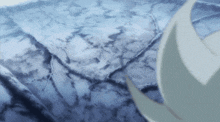 a close up of a blue surface with a few spots of white