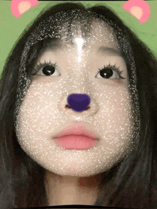 a close up of a girl 's face with a purple nose and pink lips