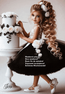 a little girl in a black and white dress stands in front of a cake