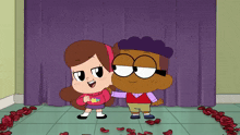 a boy and a girl standing next to each other in front of a purple curtain