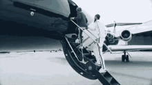 Getting Into Plane Walking Up Stairs GIF - Getting Into Plane Walking Up Stairs Private Jet GIFs