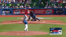 a baseball game is being played with an ad for polar ice