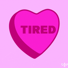 a pink heart with the word tired written inside of it