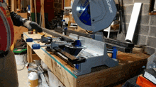 a man is using an evolution circular saw on a wooden table