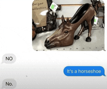 a statue of a horse 's head with a high heeled shoe on it